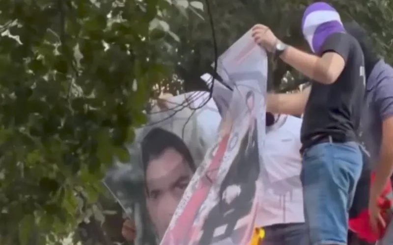 Real Madrid ultras burn a portrait of Mohammed VI near the Bernabéu
