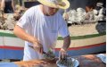 Moroccan Migrant's Journey from Stowaway to Beloved Fish Skewer Chef in Malaga