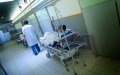 Macron Calls for Review of Immigrant Health Care Program Amid Debate