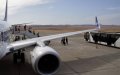 Moroccan Travelers Face COVID Risk in Crowded Airport Shuttle at Malaga