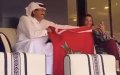 Qatar's Former Emir Waves Moroccan Flag at World Cup Match, Showing Support