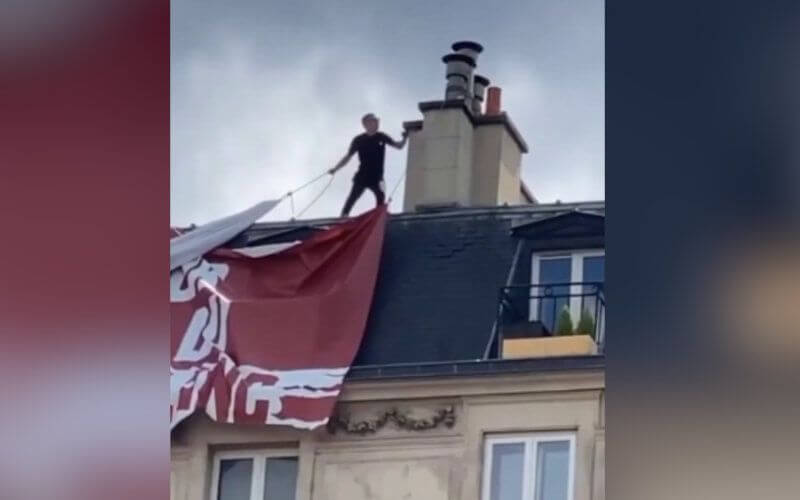 Acrobat Scales Building to Remove Far-Right 'White Lives Matter' Banner in Paris Protest