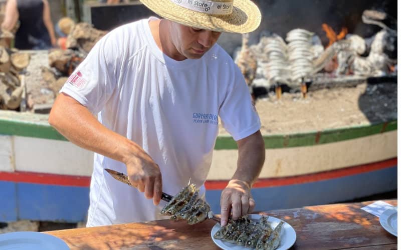 Moroccan Migrant's Journey from Stowaway to Beloved Fish Skewer Chef in Malaga
