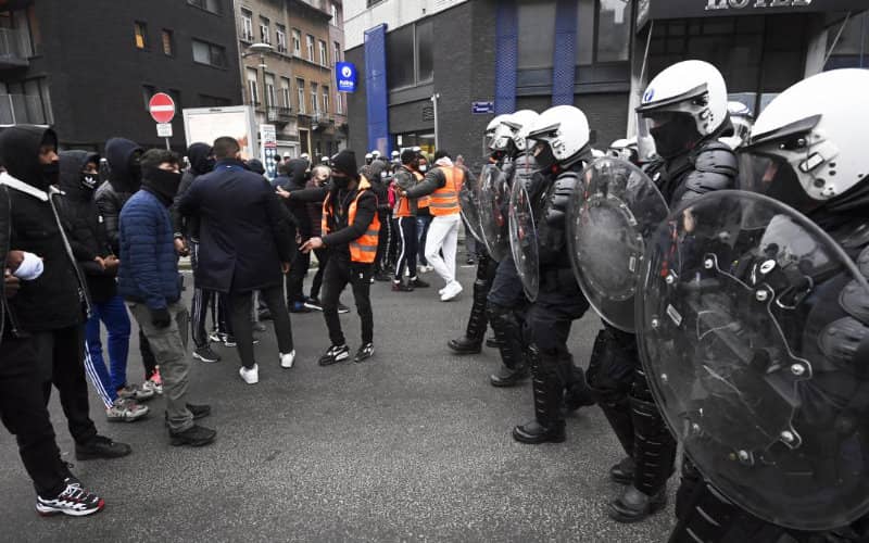Brussels Riots: Federal Policewoman Rescued by Local Resident During Violent Protest