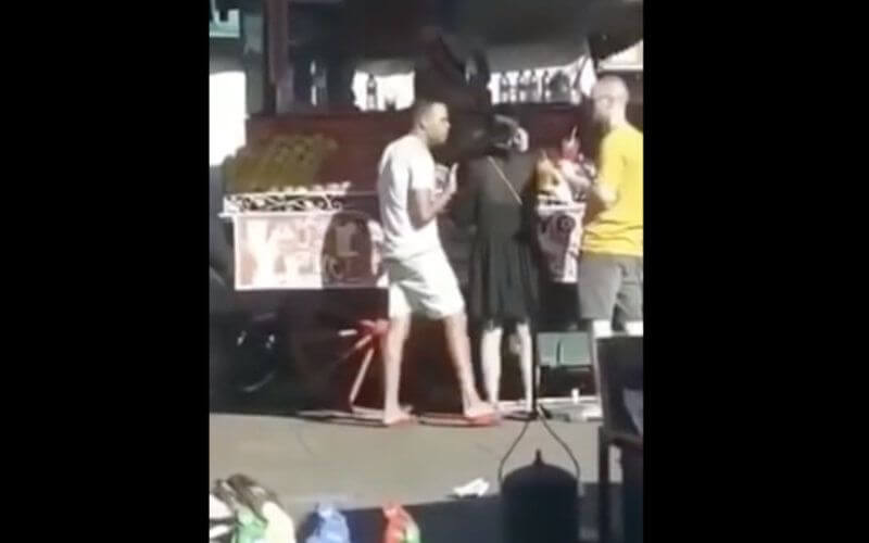 Fruit Vendor Threatens Tourists in Marrakech's Jemaâ El Fna Square