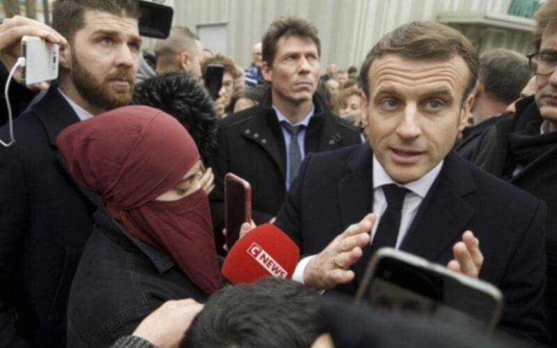 Macron's Speech on 'Islamist Separatism' Overshadowed by Veiled Woman Photo Controversy