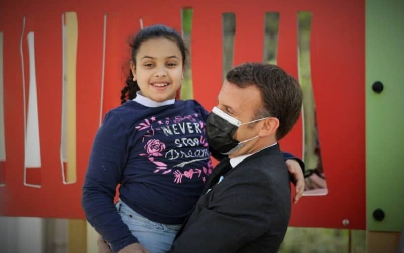 Macron's Touching Gesture to Autistic Girl Highlights World Autism Day Visit