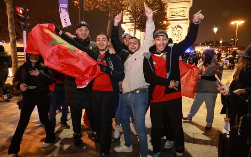 Moroccan Fans Celebrate World Cup Advancement with Peaceful Rally on Paris' Champs-Élysées