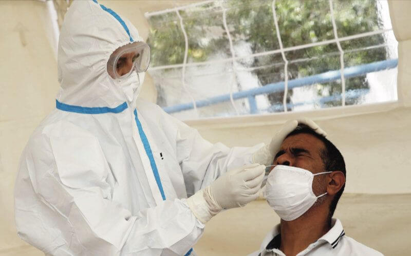 Moroccan Workers Face High Costs for Mandatory COVID-19 Tests Before Returning to Work