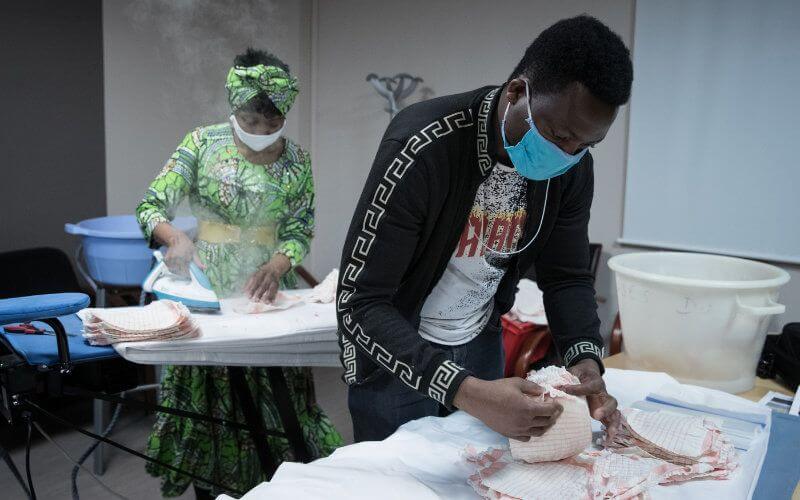 Undocumented Migrants in Paris Sew Masks to Combat COVID-19 Spread